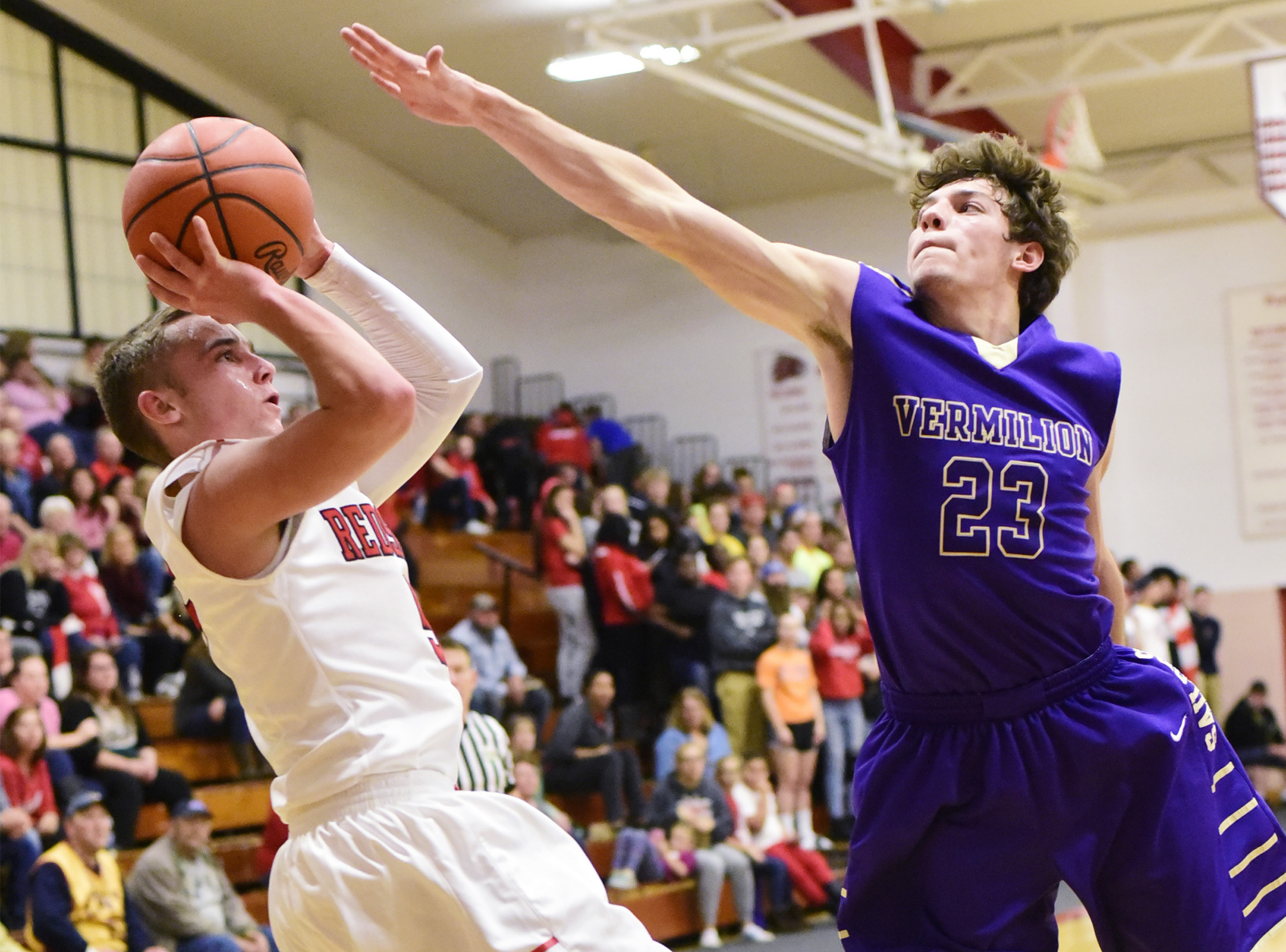 Port Clinton's Max Rumbarger makes shoots past Vermillion's Joby Pfeil.