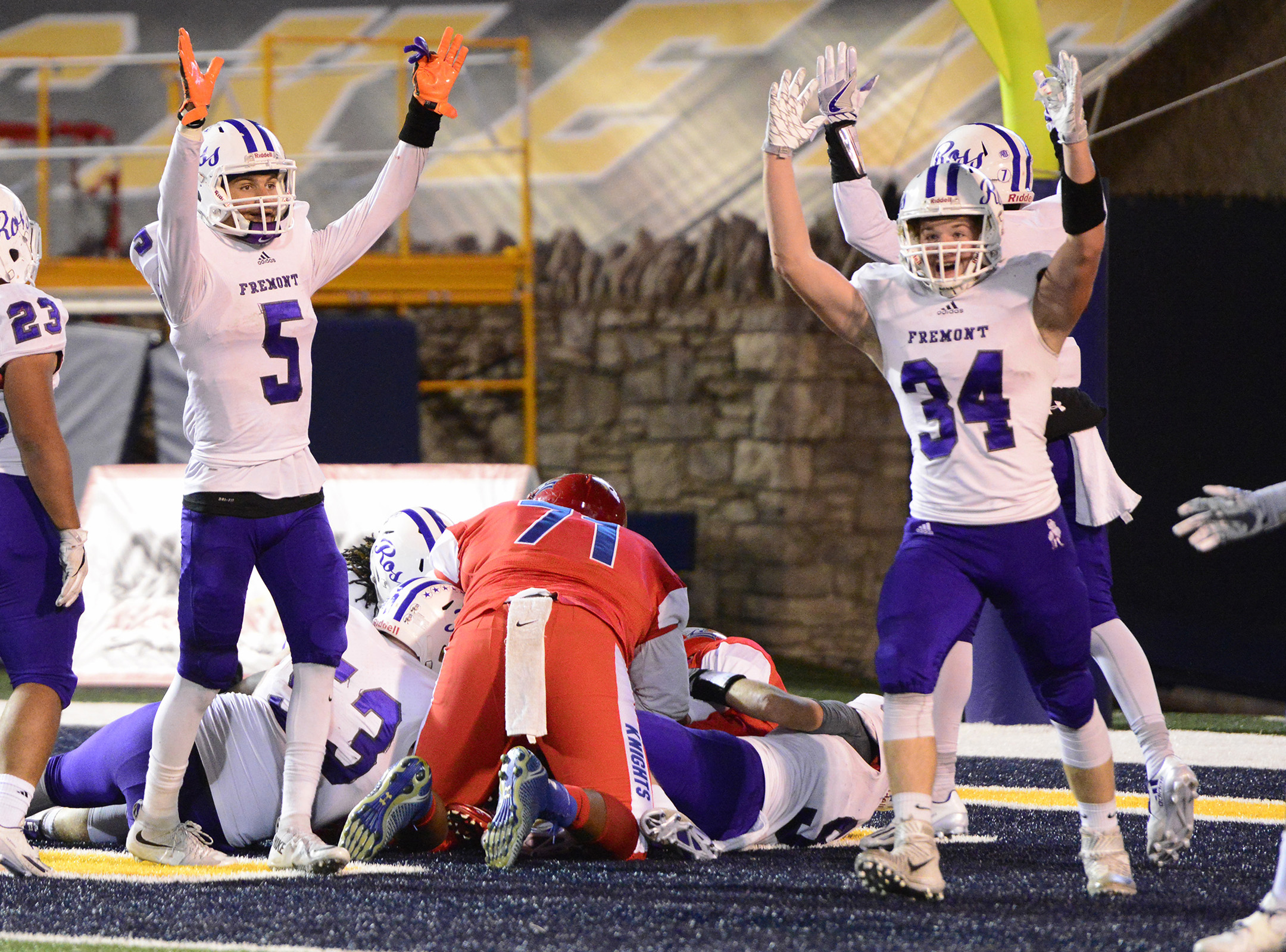 Ross celebrates scoring a touchdown after a bad snap on a St. Francis punt.