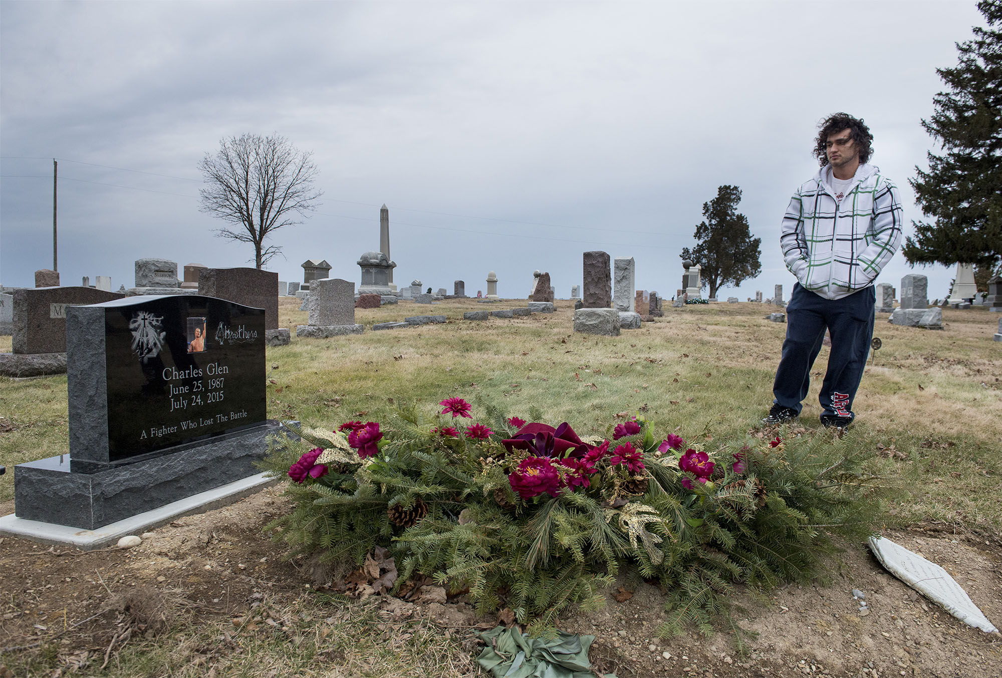 Richie Webber, 24, of Clyde reflects on the heroin overdose death of his best friend Charles Buchanan at Pleasant Ridge Cemetery.