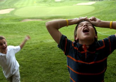 Cousins Collin Meyers, left, 7, of Littleton and Hunter Baumgarten, 11, of Highlands Ranch play during a rain delay of the PGA International Golf Tournament at Castle Pines in Castle Rock, Colo.