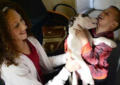 Tae Smith gets dog kisses with Arryonna Bollett, 12, of Port Clinton. Tae's friends and family try to stay positive while not knowing if he will live to see his sixth birthday.