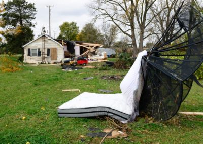 Connie Weyer's parents were in the living room when the tornado hit. They described the tornado as sounding like a whistle which only lasted a few seconds. The force of the wind blew Connie's mother's bedroom door shut. The door then blew open, and when they looked out the bedroom was gone. Connie's mother's mattress was blown halfway across the yard.