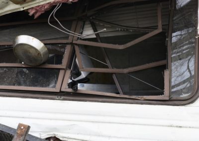 The force of the tornado picked up the Weyer's 32-foot Coachman camper, lifted it over a 10-foot deck and overturned it on its side.